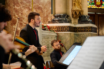 Concert in a church features instrumental performance and vocal expression