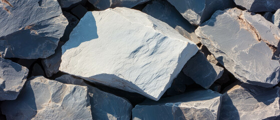 Unique textures of cracked stone with varied sizes in rough gray tones