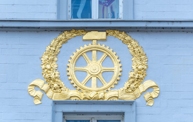 Painted facade with frescoes depicting the history of the city on an old house in the old town of...