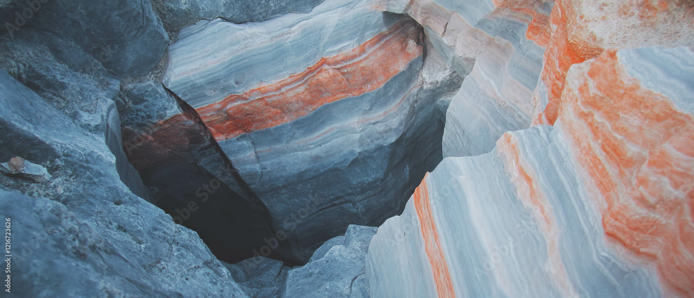 Poster quartz veins and linear formations create striking contrasts in rock textures