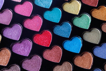 Obraz premium Heart Shaped Eyeshadow Set. Eyeshadow palette with colorful heart shaped refills close-up.