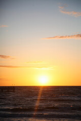 Naklejka premium Golden Sunset Over the Baltic Sea in Palanga, Lithuania, Pier Silhouette