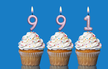 Birthday Cupcakes With Candles Lit Forming The Number 991