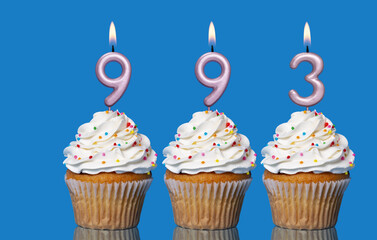 Birthday Cupcakes With Candles Lit Forming The Number 993