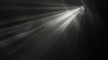 A monochromatic image showcasing beams of light emanating from a dark background.