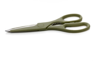 Versatile green scissors resting on a clean surface ready for crafting projects and everyday use