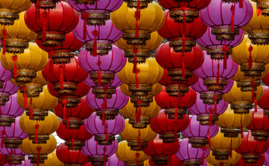Many colorful lanterns hanging in the air. © imphilip