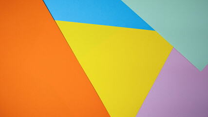 Colorful geometric shapes create a vibrant collage of paper patterns