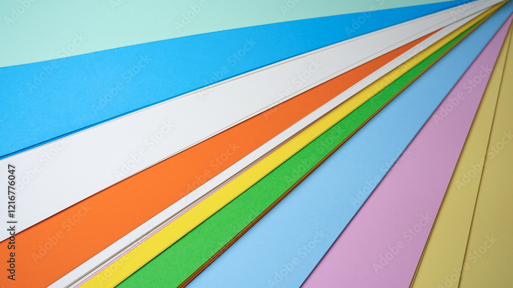 Poster colorful sheets of paper arranged in a dynamic diagonal layout