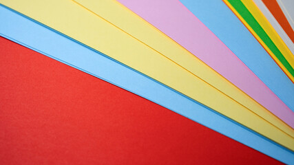 Vibrant paper sheets layered for creative projects