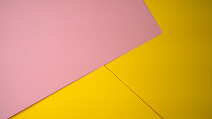 Colorful pink and yellow papers create an artistic display