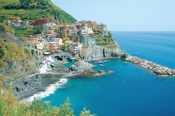 Picturesque Italian Village Clinging to Cliffside Overlooking the Sparkling Azure Mediterranean Sea