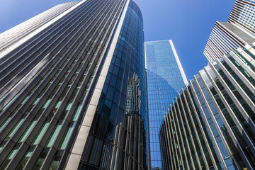 Modern Glass Skyscrapers Reflecting Blue Sky in a Financial District Urban Cityscape