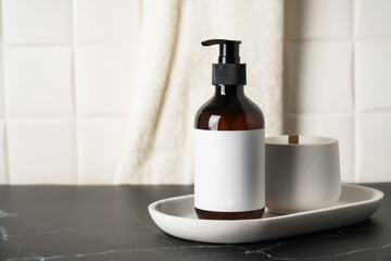 Liquid soap bottle in the bathroom. Brown glass pump bottle.