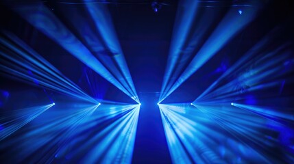 A vibrant display of blue laser lights creating an energetic atmosphere.