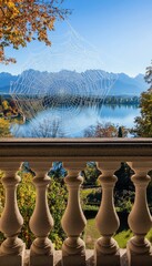 A beautifully crafted spider s web with dew, set against lake chiemsee and the bavarian alps