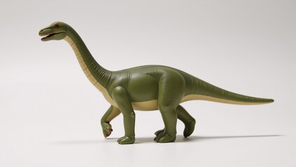 Naklejka premium Isolated Diplodocus toy against white backdrop