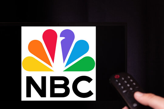 NBC logo captured on TV screen with remote control in front.