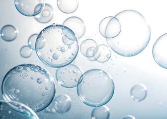 Water bubbles isolated on a white background, highlighting their transparency and natural light reflections.