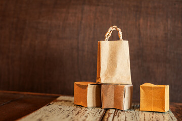 Paper shopping bag and cardboard box on table. Ideas about online shopping addiction. offers home...