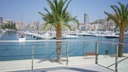 Blurred outdoor scene with defocused palm trees, boats, and a marina view with a blue sky in the background.