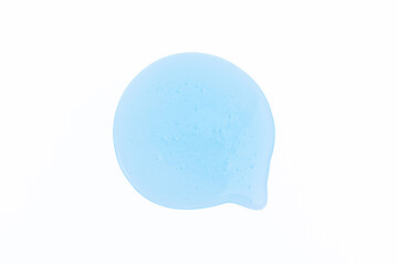 Round smear of cosmetic gel with a bubbly texture on a white background