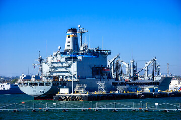 A large ship is docked at the pier