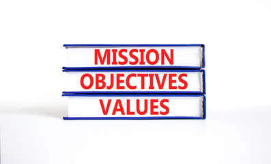 Mission objectives values symbol. Concept words Mission Objectives Values on beautiful blue white books. Beautiful white background. Business mission objectives values concept. Copy space.