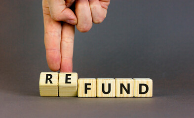 Fund or refund symbol. Concept words Fund Refund on wooden cubes. Beautiful grey table grey...