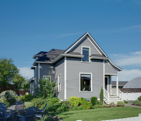 A traditional cottage in Oregon nestled in lush landscapes, offering a tranquil retreat.