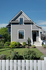 A cozy Oregon traditional cottage nestled in lush landscapes, offering a tranquil retreat.	