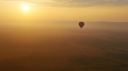 Fototapeta premium A hot air balloon floating over the temples of Bagan, offering a breathtaking aerial view of the ancient pagodas and stunning landscape at sunrise, capturing the beauty of Myanmar's cultural heritage