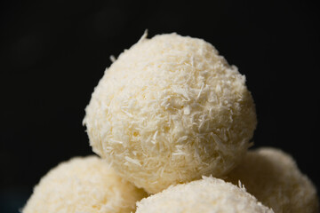 Delicious and exquisite candy with almonds and coconut flakes. Concept of delicious holiday homemade dishes