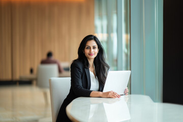 Professional indian business woman manager executive working on laptop