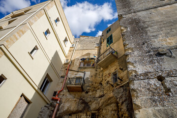 Historic Stone Buildings with Balconies and Dramatic Vertical View
