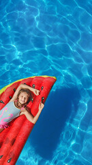 Child in swimming pool. Having fun on vacation at the hotel pool. Colorful vacation concept.