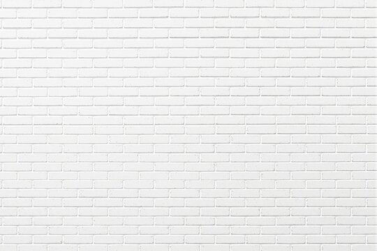 Fototapeta White brick wall background with clean texture and seamless design.