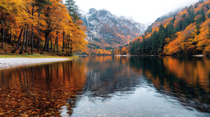 Naklejka premium Autumn foliage reflects on a calm lake surrounded by majestic mountains