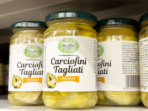 Jarred carciofini tagliati artichokes in oil on store shelf