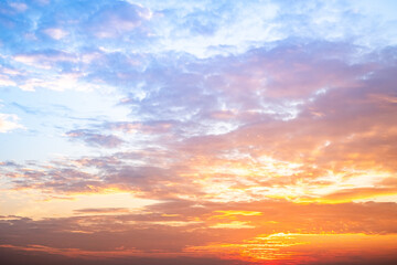 Fototapeta premium Beautiful , luxury soft gradient orange gold clouds and sunlight on the blue sky perfect for the background, take in evening,Twilight, Large size, high definition landscape photo