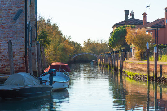 Torcello canal with bridge and docked boats