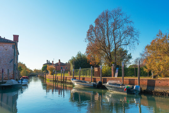 Boats along a peaceful Torcello canal