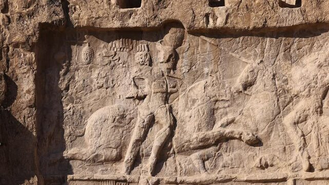 Naqsh-e Rostam necropolis of Persepolis in Fars Province with tomb of Darius I the Great, Iran. The tombs of the ancient Persian kings are decorated with bas-reliefs carved into the rocks