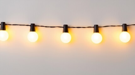 A string of warm yellow lights hangs against a neutral background, creating a cozy and inviting atmosphere.