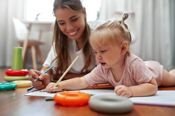 Joyful and Fun Playtime A Loving Mother and Her Child Engaged in Exciting Creative Arts Together