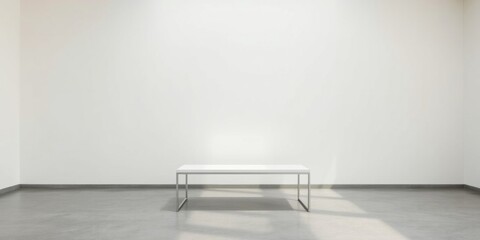 Minimalist interior design a sleek white table against a blank white wall in a sunlit room