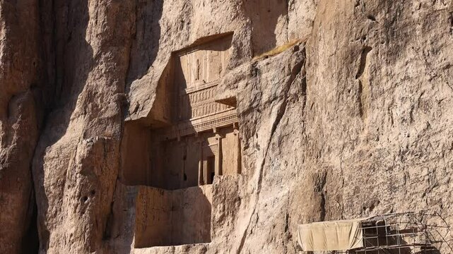 Naqsh-e Rostam necropolis of Persepolis in Fars Province with tomb of Darius I the Great, Iran. The tombs of the ancient Persian kings are decorated with bas-reliefs carved into the rocks