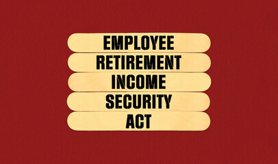 Concept word ERISA Employee Retirement Income Security Act on beautiful wooden stick. Beautiful Red Chart Paper Background. Business and Employee Retirement Income Security Act concept. Copy space