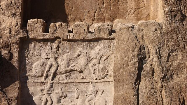 Naqsh-e Rostam necropolis of Persepolis in Fars Province with tomb of Darius I the Great, Iran. The tombs of the ancient Persian kings are decorated with bas-reliefs carved into the rocks