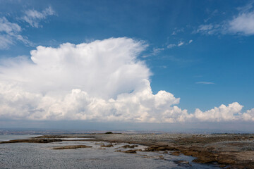 Coastal Landscape with Dramatic Clouds and Rocky Shore